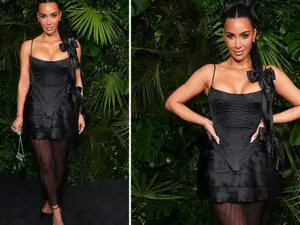 Kim Kardashian turns up as black Barbie with bows for Chanel's pre-Oscars dinner in Los Angeles