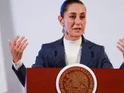 Mexico draws line on US deportation flights but vows to welcome back citizens 'with open arms'