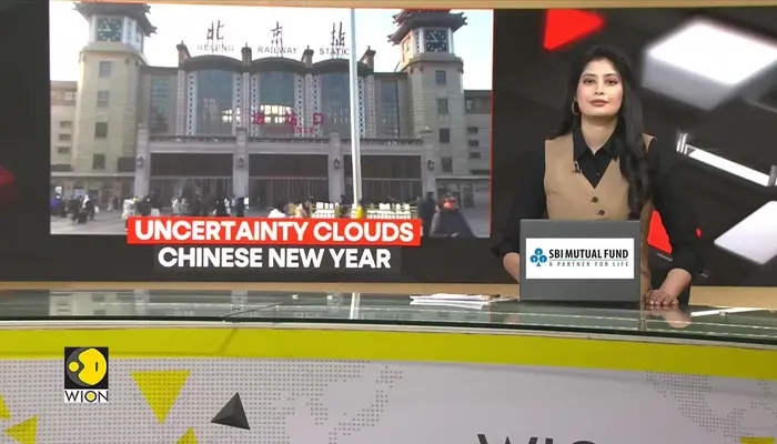 Lunar new year travellers in China face economic uncertainty