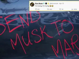 Protestor says 'SEND MUSK TO MARS,' Tesla CEO says 'I'm trying'