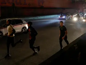 Dozens arrested, three hurt by car in Paris after PSG beat Arsenal in Champions League