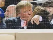 'THAT is how to handle the kiss cam kiss,' Donald and Melania Trump’s stadium kiss goes viral