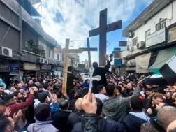 Hundreds hit the streets as protest erupts over burning of Christmas tree near Syria's Hama