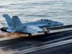 US Navy fighter jet worth $60 million lost at sea after it fell off aircraft carrier during Houthi attack