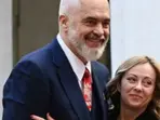 WATCH | Albanian PM goes down on one knee, surprises Giorgia Meloni with scarf on birthday