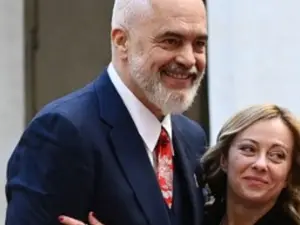WATCH | Albanian PM goes down on one knee, surprises Giorgia Meloni with scarf on birthday