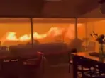 Video: Men and dog trapped in house as Los Angeles wildfire rage