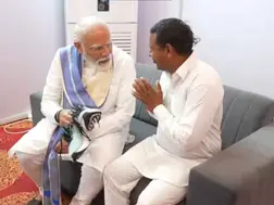 PM Modi meets Haryana admirer who vowed to stay barefoot until he became PM, helps him wear shoes-WATCH