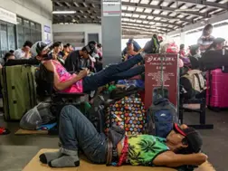 Naked man covered in mud found clinging to airplane landing gear at Manila airport