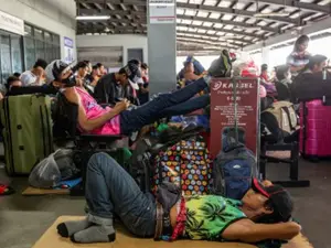 Naked man covered in mud found clinging to airplane landing gear at Manila airport
