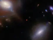 13-billion-year-old galaxy mysteriously crosses a cosmic veil to reach Webb