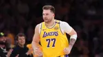 Luka Doncic fights through emotions in Dallas as LA Lakers beat Mavs for playoff spot