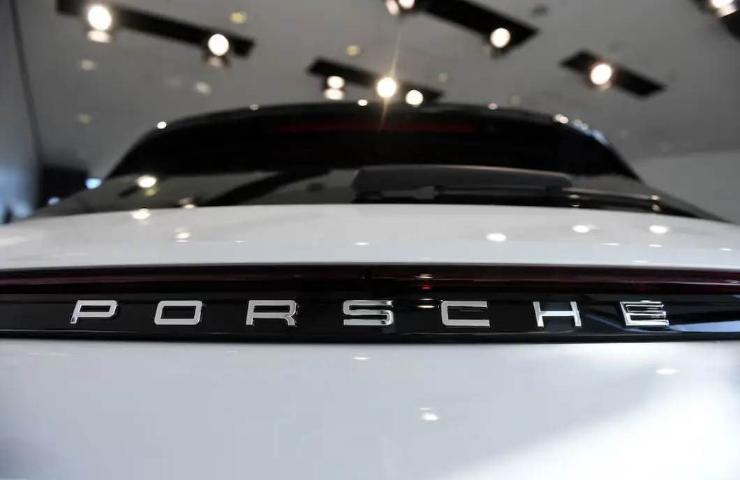 Porsche slashes outlook as US tariffs and China weakness bite