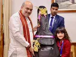 Amit Shah 'deeply moved' by seven-year-old's singing talent, gifts guitar: WATCH