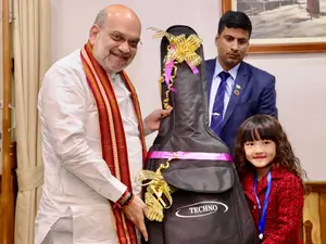 Amit Shah 'deeply moved' by seven-year-old's singing talent, gifts guitar: WATCH