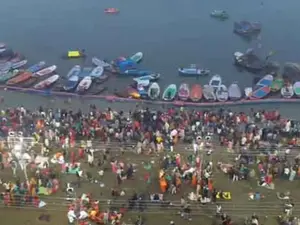 Devotees brave biting cold to take holy dip in Sangam on day 3 of Maha Kumbh 2025