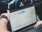 Work from car | Bengaluru IT employee fined for using laptop while driving