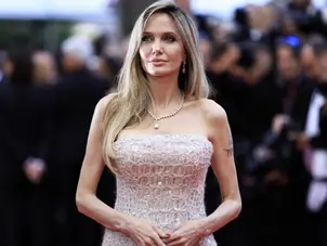 Angelina Jolie is a vision in white as she walks red carpet as Cannes Godmother