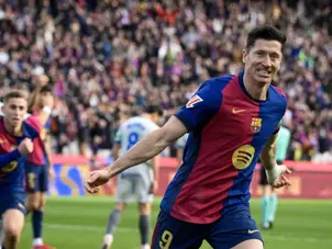 Barcelona's Robert Lewandowski becomes first player in Champions League history to...