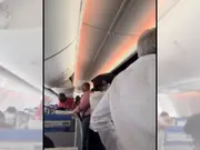 American mocks Indians rushing to fetch bags in moving flights. People say, 'Canada and US too'