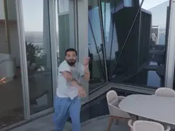 Drake aims his slipper at drone hovering around his apartment in viral video, Internet thinks it's staged