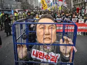 South Korean prosecutors seek arrest warrant for ousted president Yoon as he defies summons