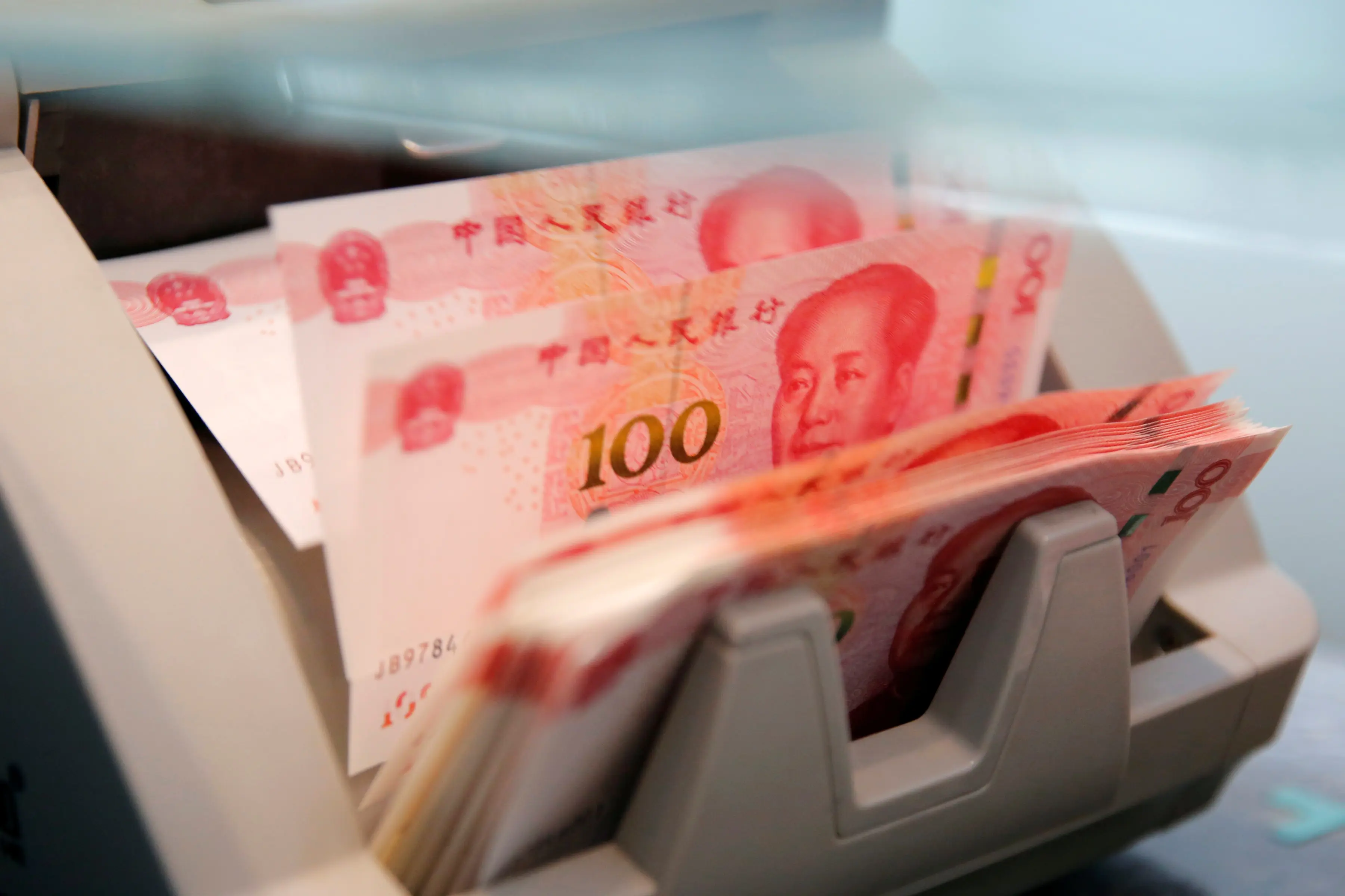 China's record capital outflows pile pressure on yuan