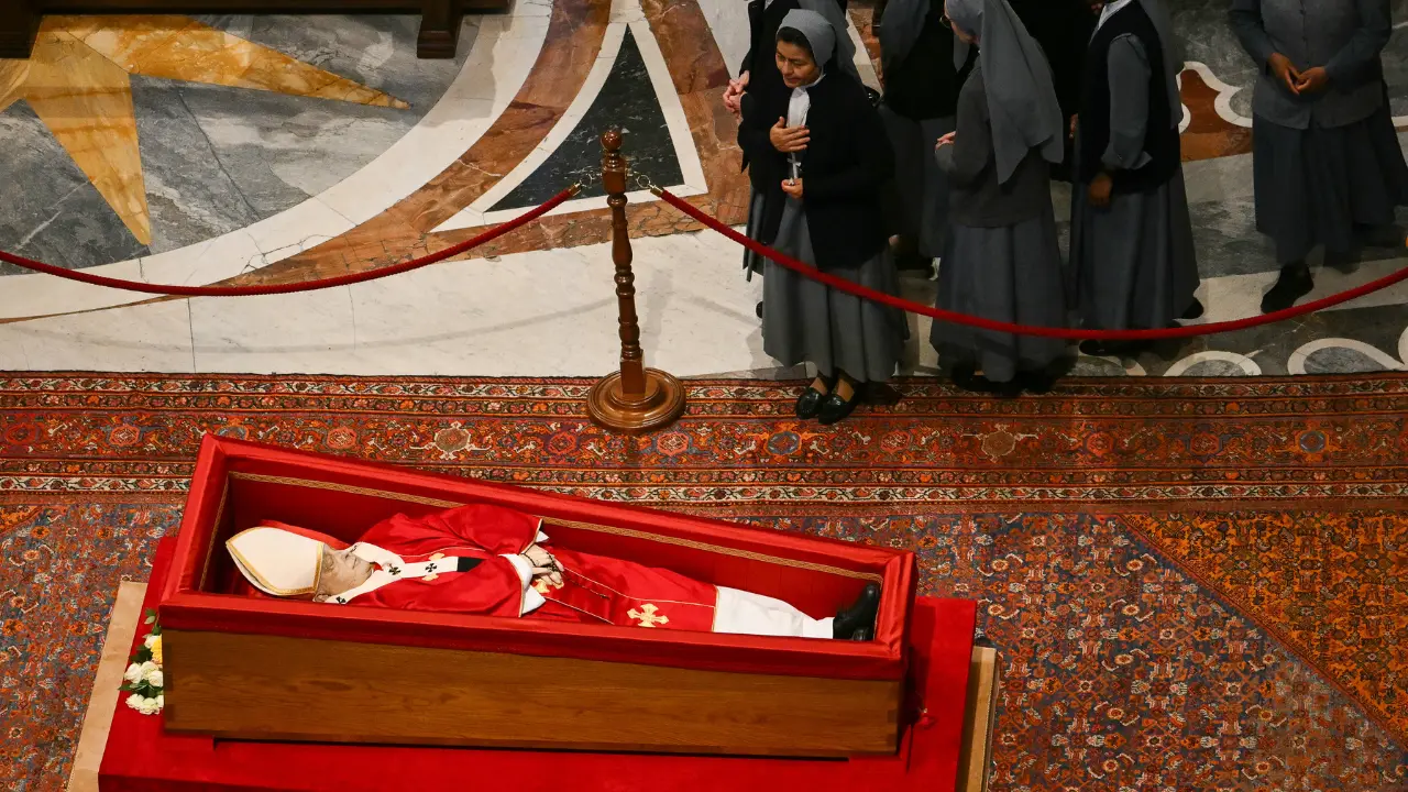 'What a rotten age': Mourners take smiling selfies with Pope Francis' body in casket, triggers outrage