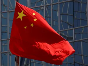 China to 'firmly counter' US trade pressure, says foreign minister