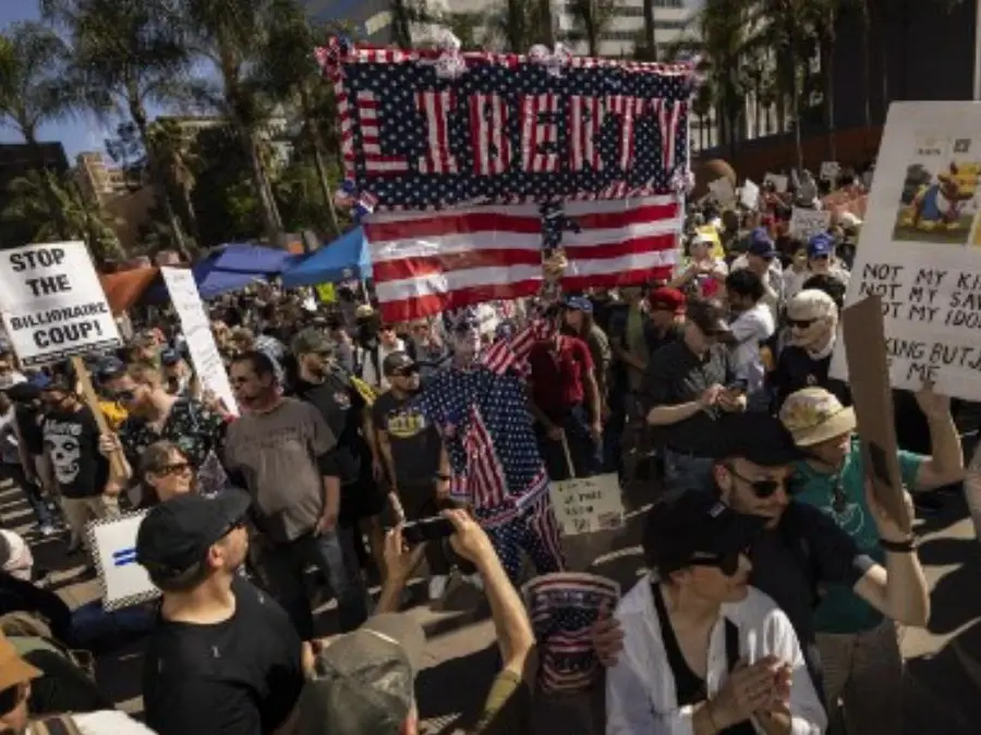 Tens of thousands march in US against Trump 'devastation'