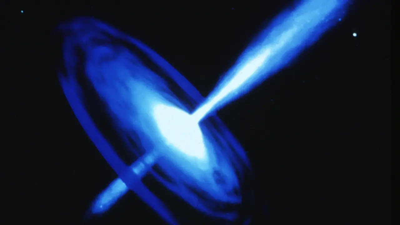 Supermassive black hole 12,500,000,000 light-years away is shooting jets towards Earth. What does it mean?