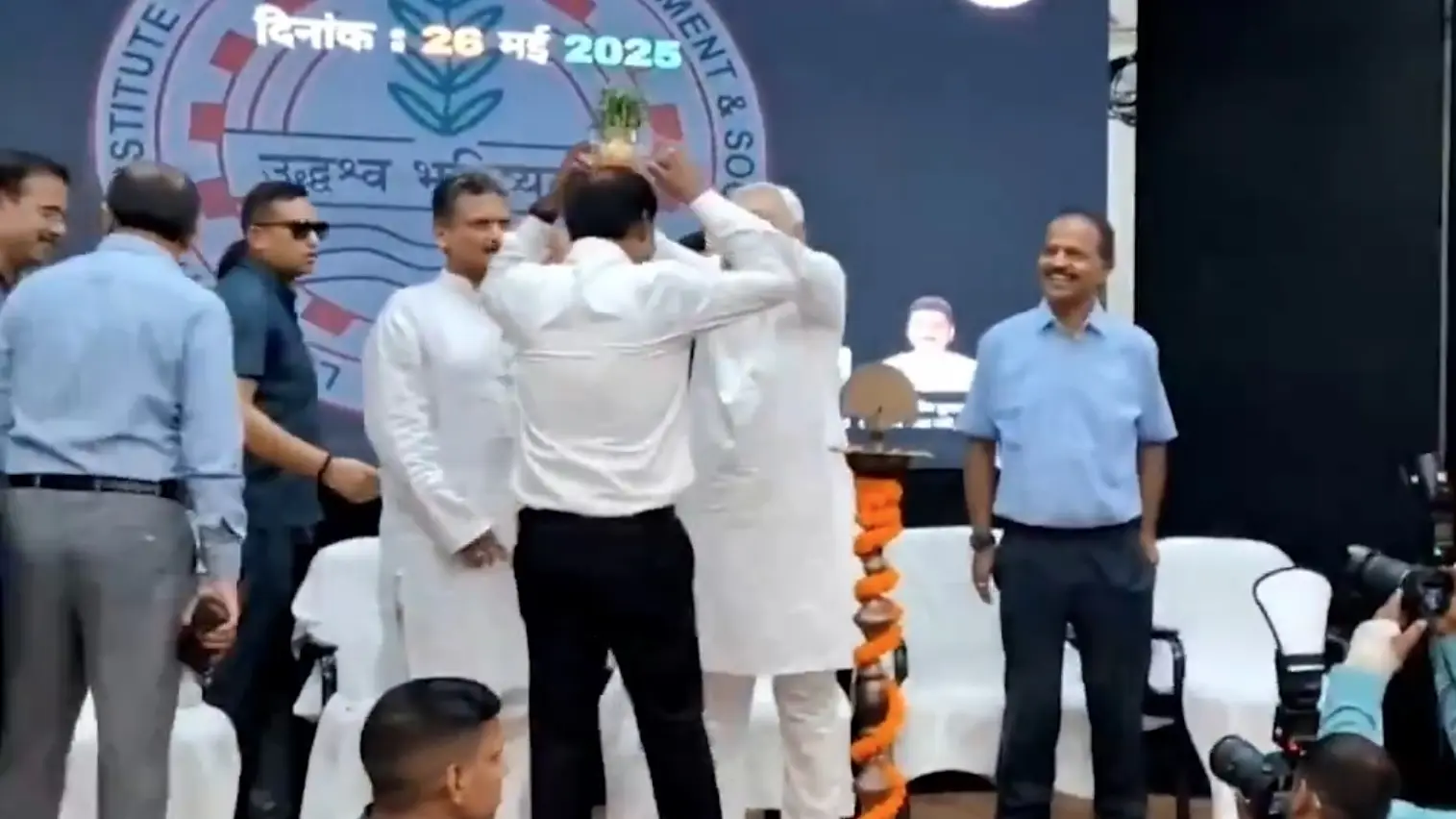 Bihar CM Nitish Kumar playfully places plant pot on official’s head, sparks concern about his health | Watch Bihar CM Nitish Kumar playfully places plant pot on official’s head, sparks concern about his health | Watch