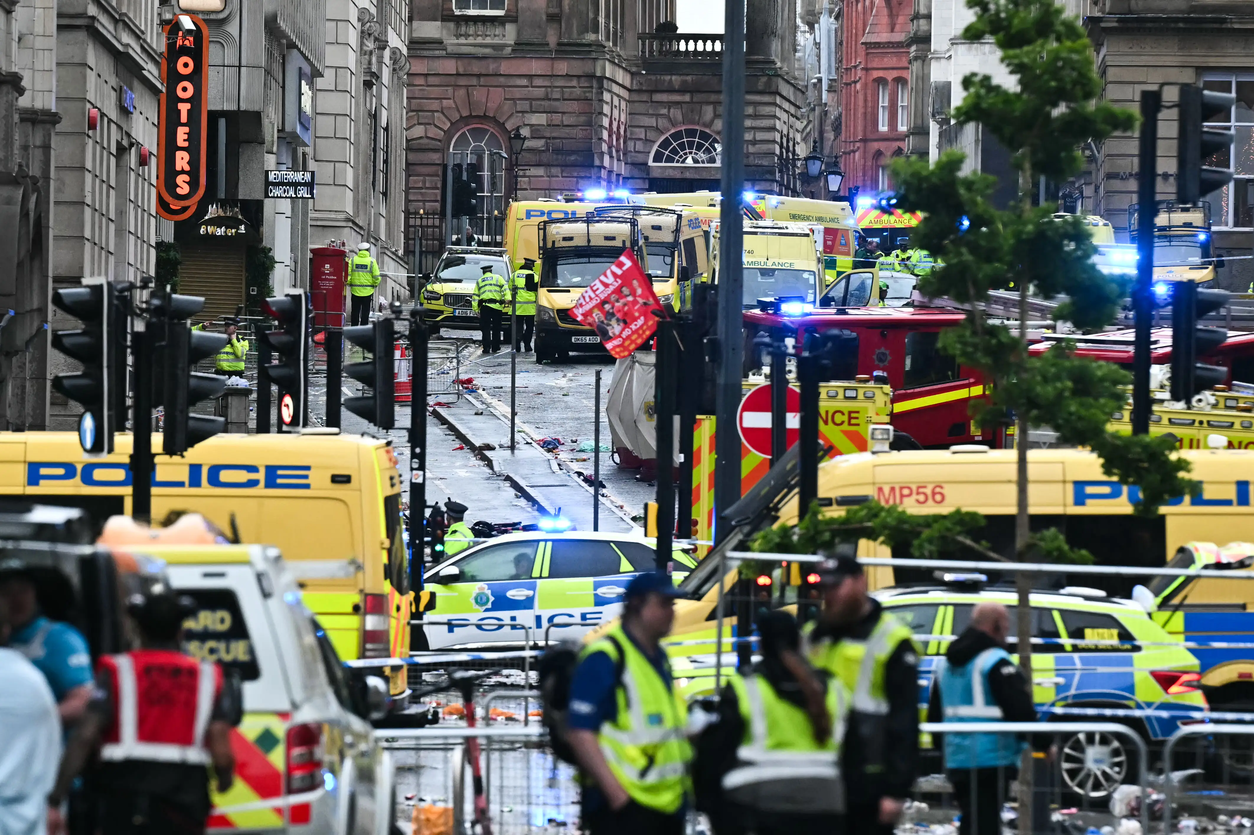 Football unites after car ploughs into Liverpool victory parade