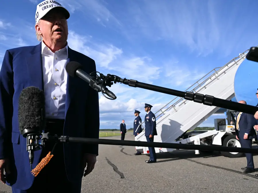 Frustrated Trump calls a reporter "you're fake news" when asked what he was going to do about Vladimir Putin