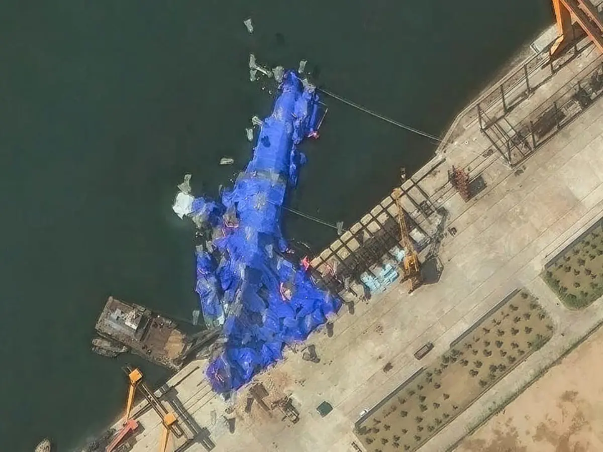 North Korea arrests 4 over failed warship launch, evidence covered with tarpaulin to save Kim from embarrassment