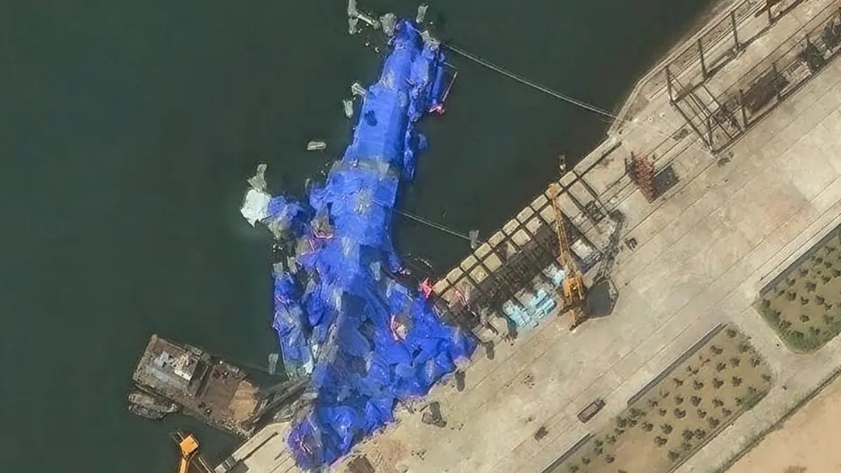 North Korea arrests 4 over failed warship launch, evidence covered with tarpaulin to save Kim from embarrassment North Korea arrests 4 over failed warship launch, evidence covered with tarpaulin to save Kim from embarrassment