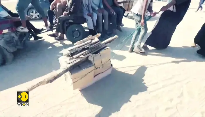  Israel-Gaza war: Gazans seen rushing for food as aid truck arrives 
