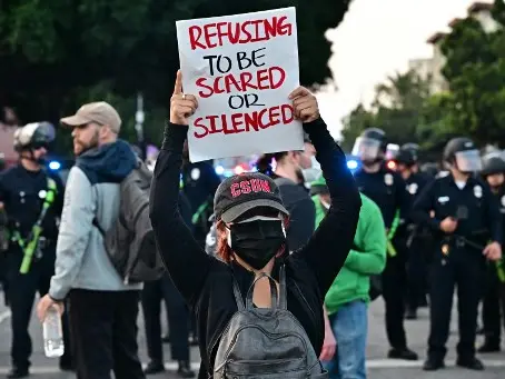  Tensions flare up between police and demonstrators as immigration protests spread to Dallas 
