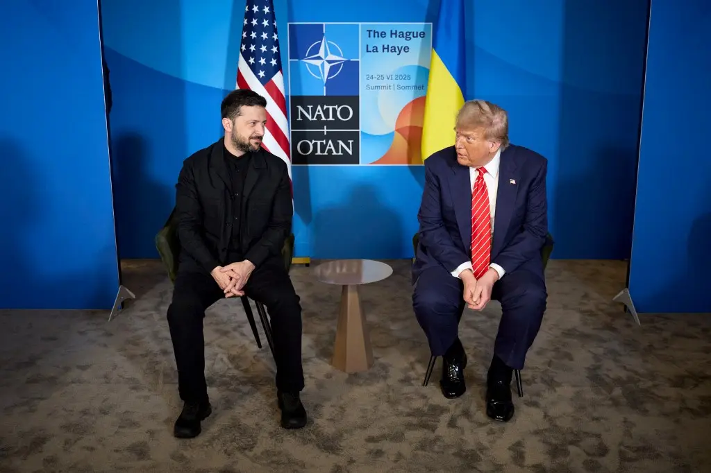 ‘Yes, he OWNS a suit’: Zelensky ditches military gear for 'very nice' Trump meeting at NATO summit