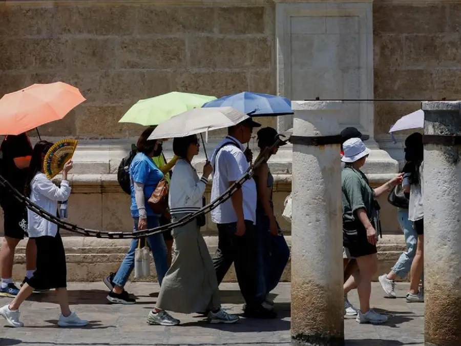 Europe bakes as heatwave breaks records; nations issue red alerts, mull work bans