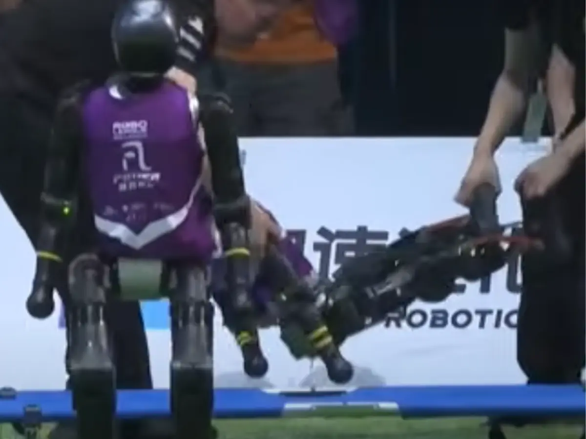 CRASH, TRAMPLE, REPEAT: Robots carried off on stretchers at ROBO football match in China CRASH, TRAMPLE, REPEAT: Robots carried off on stretchers at ROBO football match in China