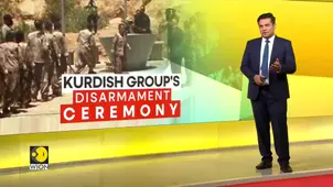 Kurdish fighters hand over weapons in symbolic gesture