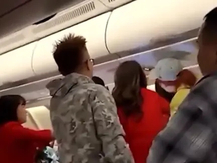 'Shut up, are you stupid?: Mid air brawl erupts on Air Asia flight en route to China from Kuala Lumpur 'Shut up, are you stupid?: Mid air brawl erupts on Air Asia flight en route to China from Kuala Lumpur