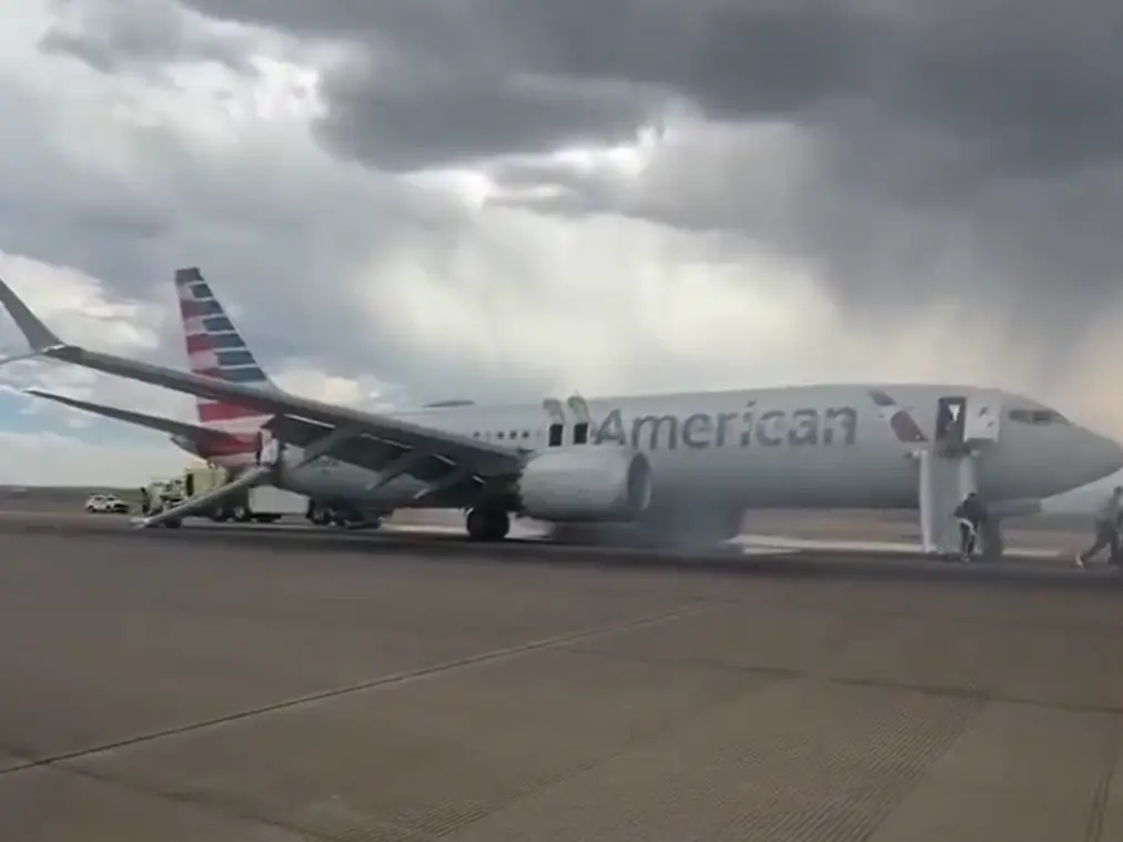 WATCH: Passengers evacuated from American Airlines jet as Boeing aircraft catches fire at Denver airport WATCH: Passengers evacuated from American Airlines jet as Boeing aircraft catches fire at Denver airport