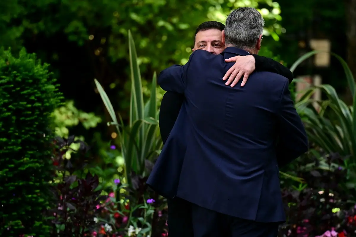 Day before Trump-Putin meet, Zelensky meets, hugs UK PM