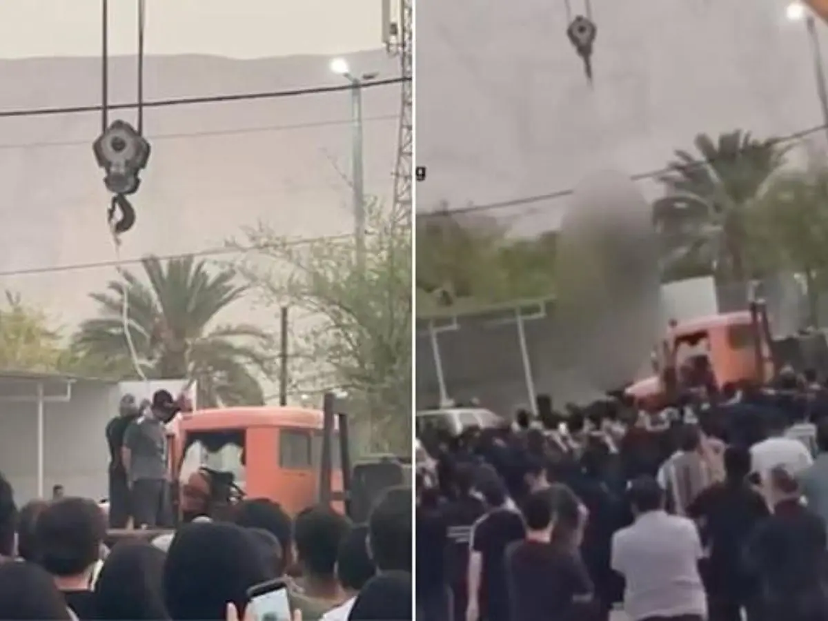 Iranian man convicted of murder hanged publicly from a crane at crime scene Iranian man convicted of murder hanged publicly from a crane at crime scene