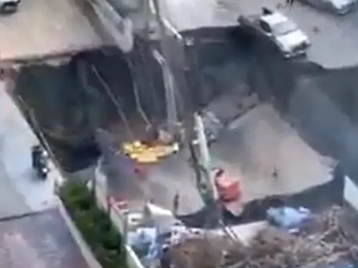 Massive sinkhole opens in Bangkok, swallows cars, electricity pole - WATCH Massive sinkhole opens in Bangkok, swallows cars, electricity pole - WATCH