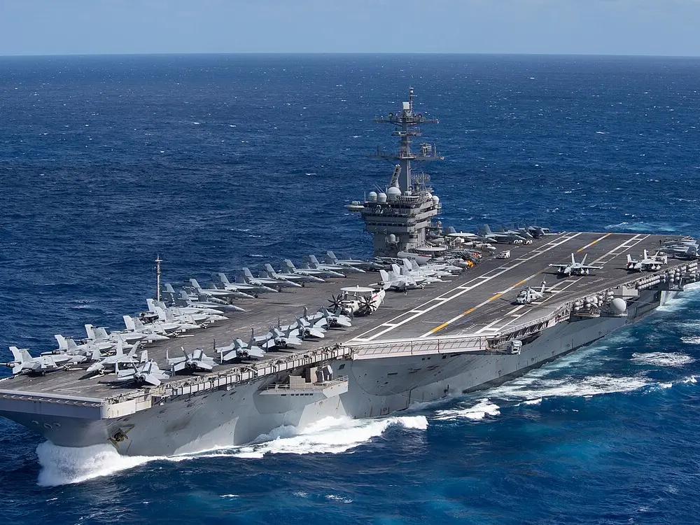 Can it go faster than 56 km/h? Why is the 2-nuclear-reactor-powered USS Abraham Lincoln so slow