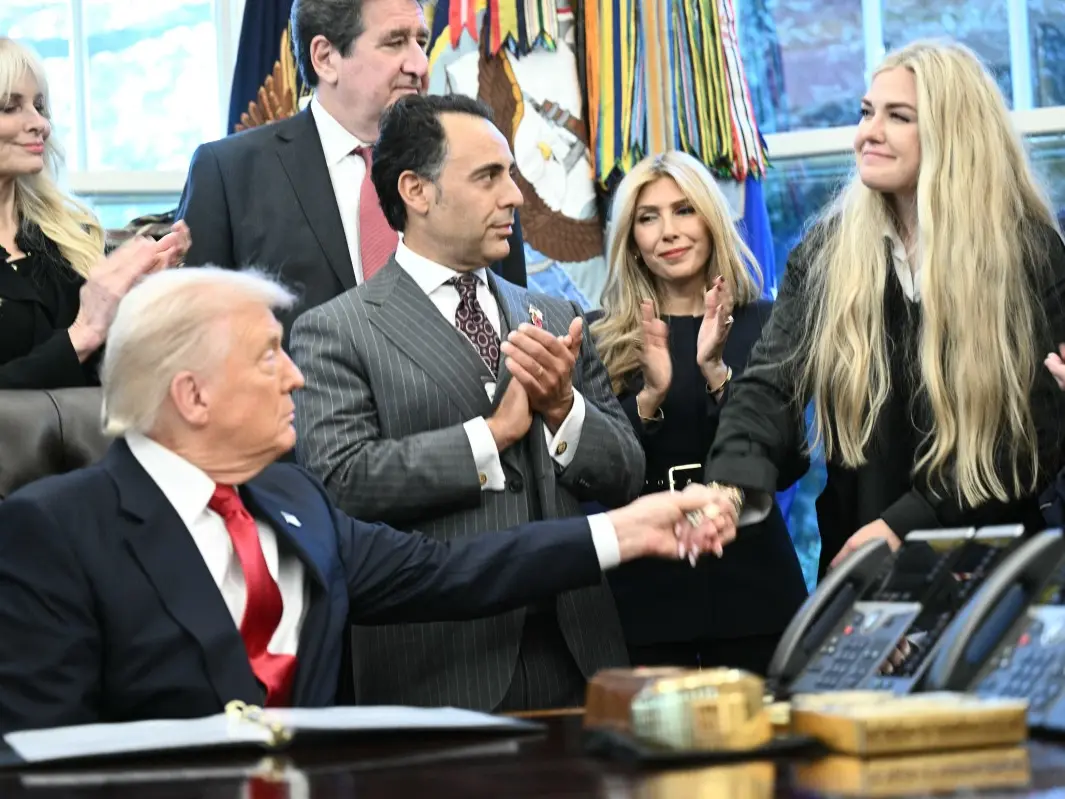 Erika Kirk and Donald Trump share a kiss during the swearing in of Sergio Gor Erika Kirk and Donald Trump share a kiss during the swearing in of Sergio Gor