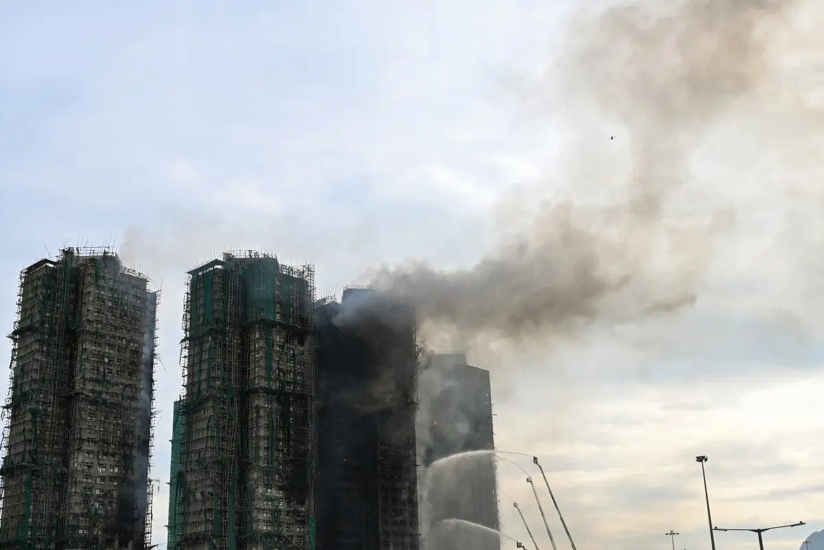 Hong Kong high-rise fire continues to burn; death toll rises to 55, hundreds still unaccounted for